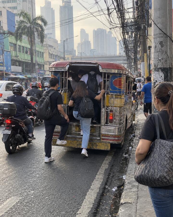 A jeepney on a busy Manila street in the morning