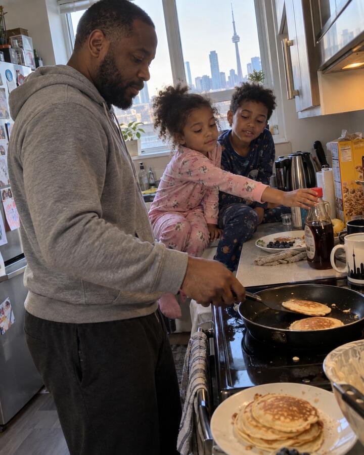 Dayo making pancakes with his two kids